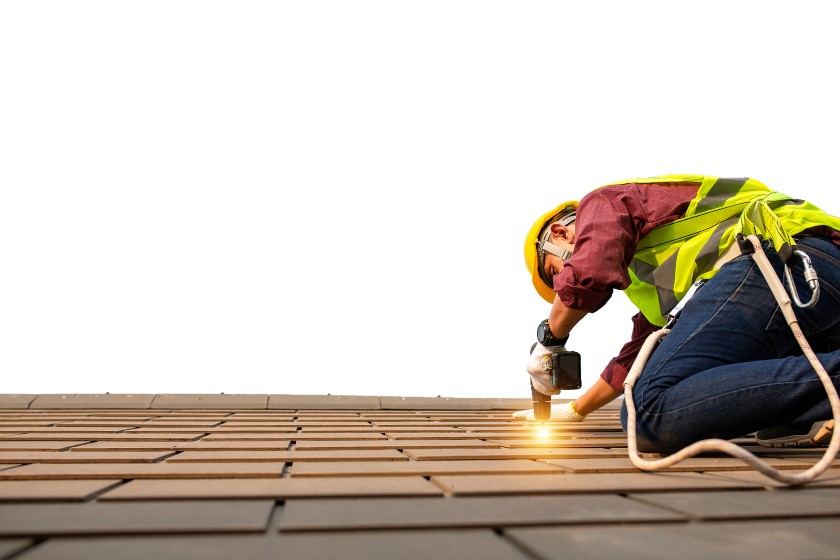Roofer installing new shingles on a home